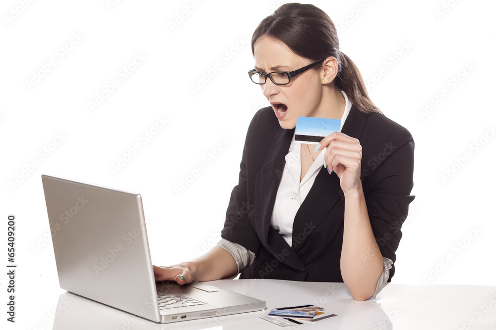 very nervous business woman holding credit card very nervous business woman holding credit card