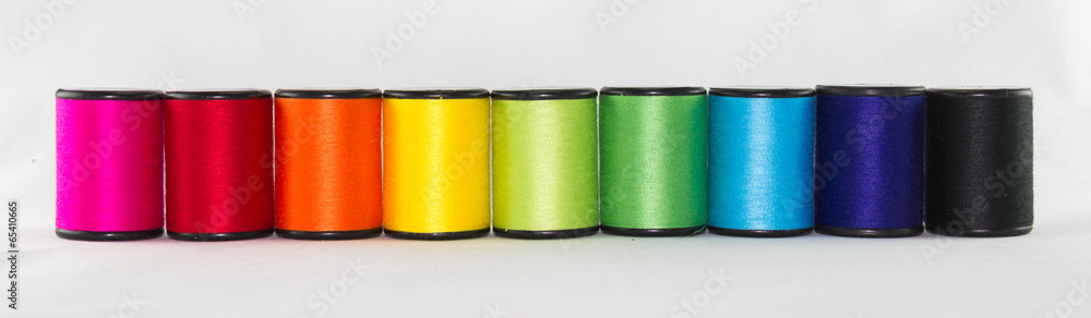 set of color threads on a white background set of color threads on a white background