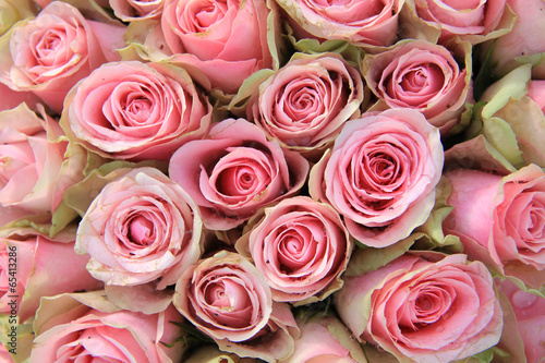 Pink roses in a wedding arrangement