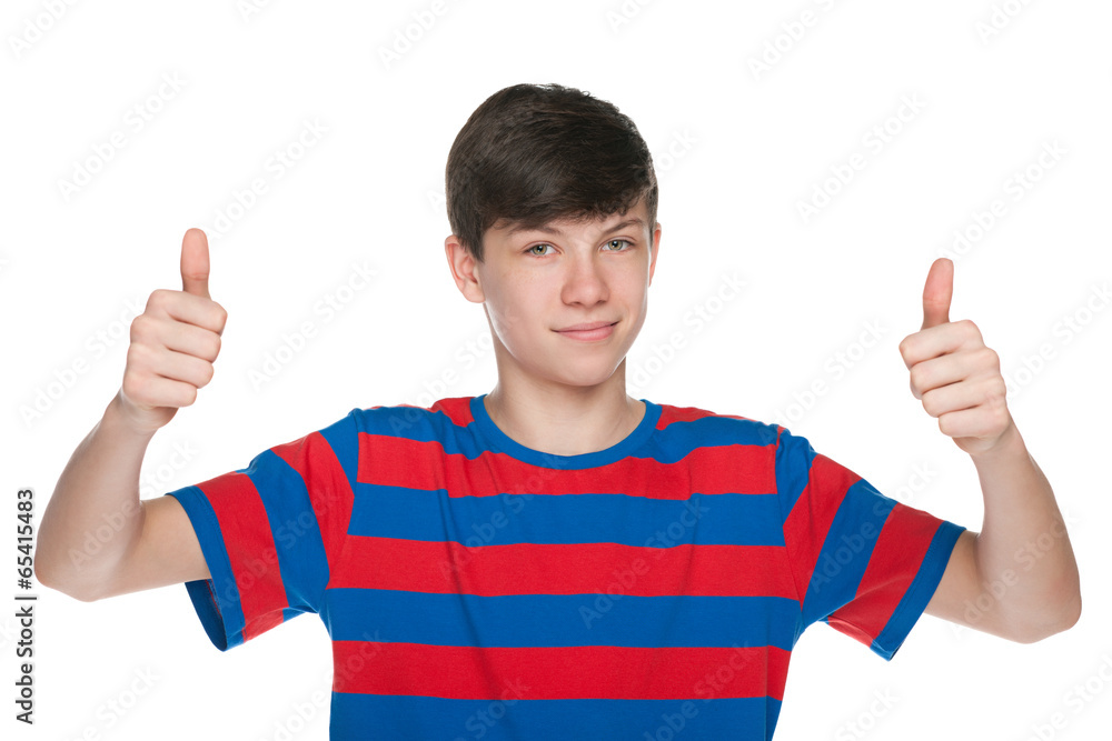 Teen boy holds his thumbs up Teen boy holds his thumbs up