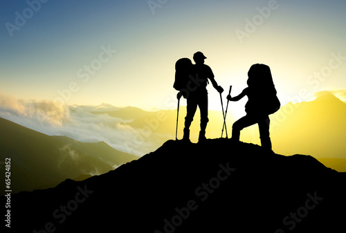 Tourist team on peak. Sport and active life concept © biletskiyevgeniy.com