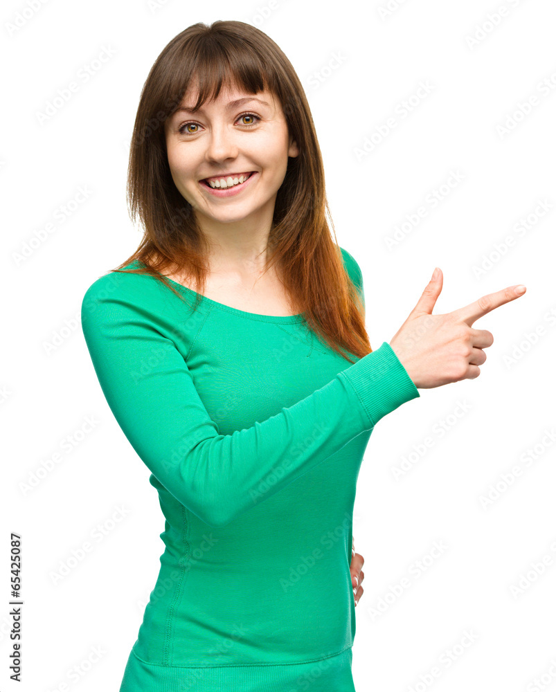 Portrait of a young woman pointing to the right Portrait of a young woman pointing to the right