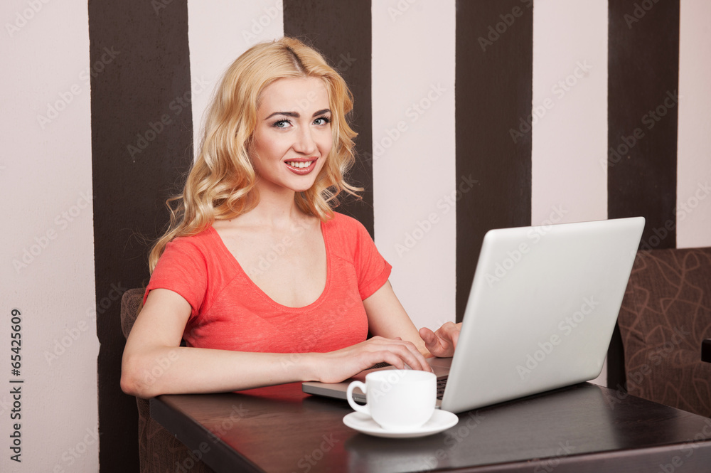 beautiful young girl working on computer. beautiful young girl working on computer.