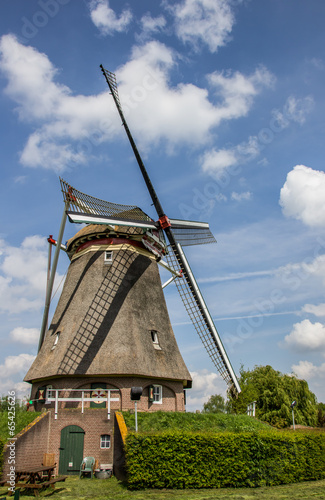 Beatrix mill in Winssen against a blue sky photo