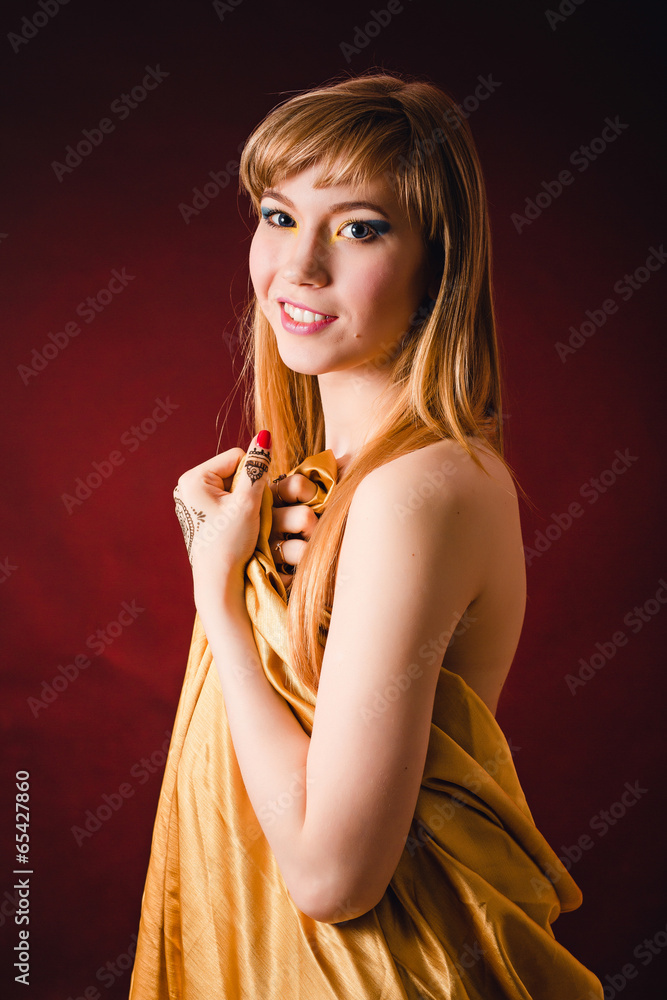 Naked woman is wrapped in the gold cloth Stock Photo Adobe Stock