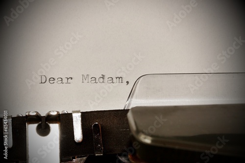 Text Dear madam typed on old typewriter