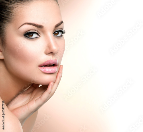 Beauty Spa Woman Portrait. Beautiful Girl Touching her Face