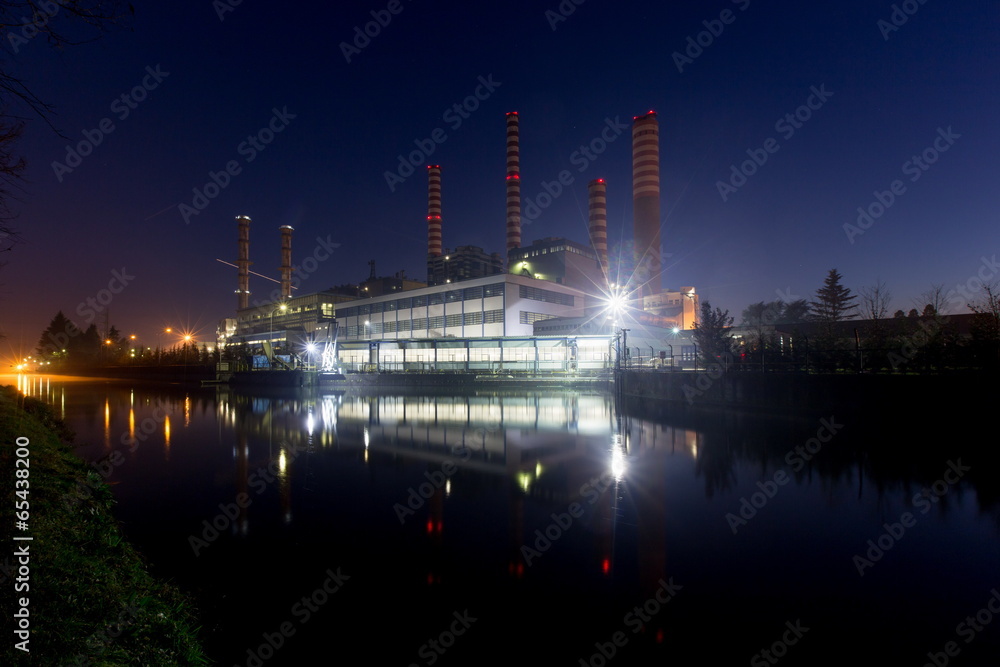 Fototapeta premium Electricity power plant near a river