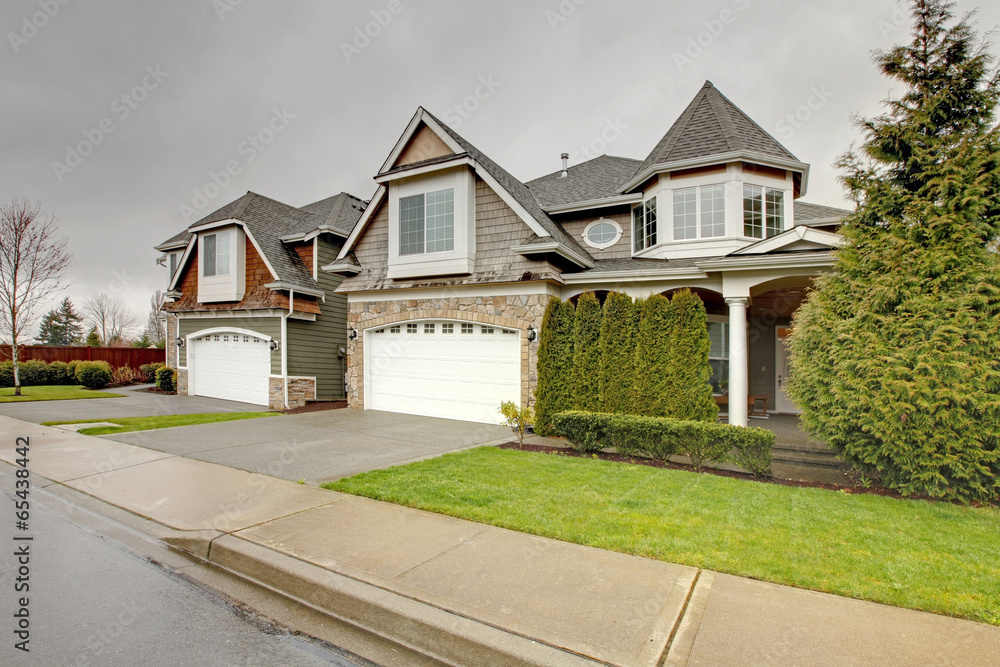 House with stone wall trim and column porch