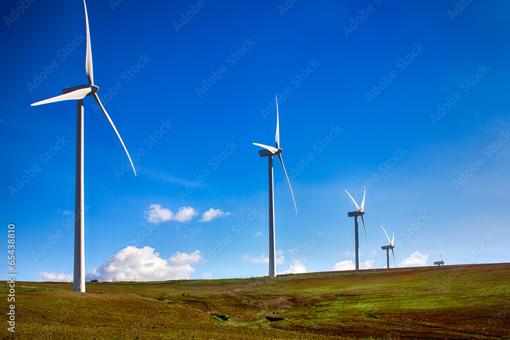 Wind turbines on green meadow. Spain Wind turbines on green meadow. Spain