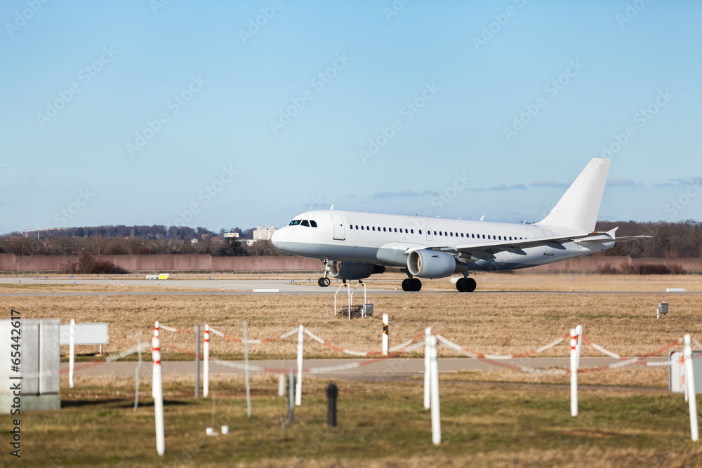 Passenger airliner taking off at an airport