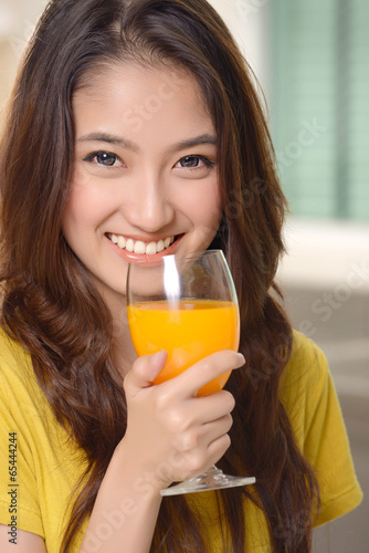 Asian young women cute woman drinking orange juice