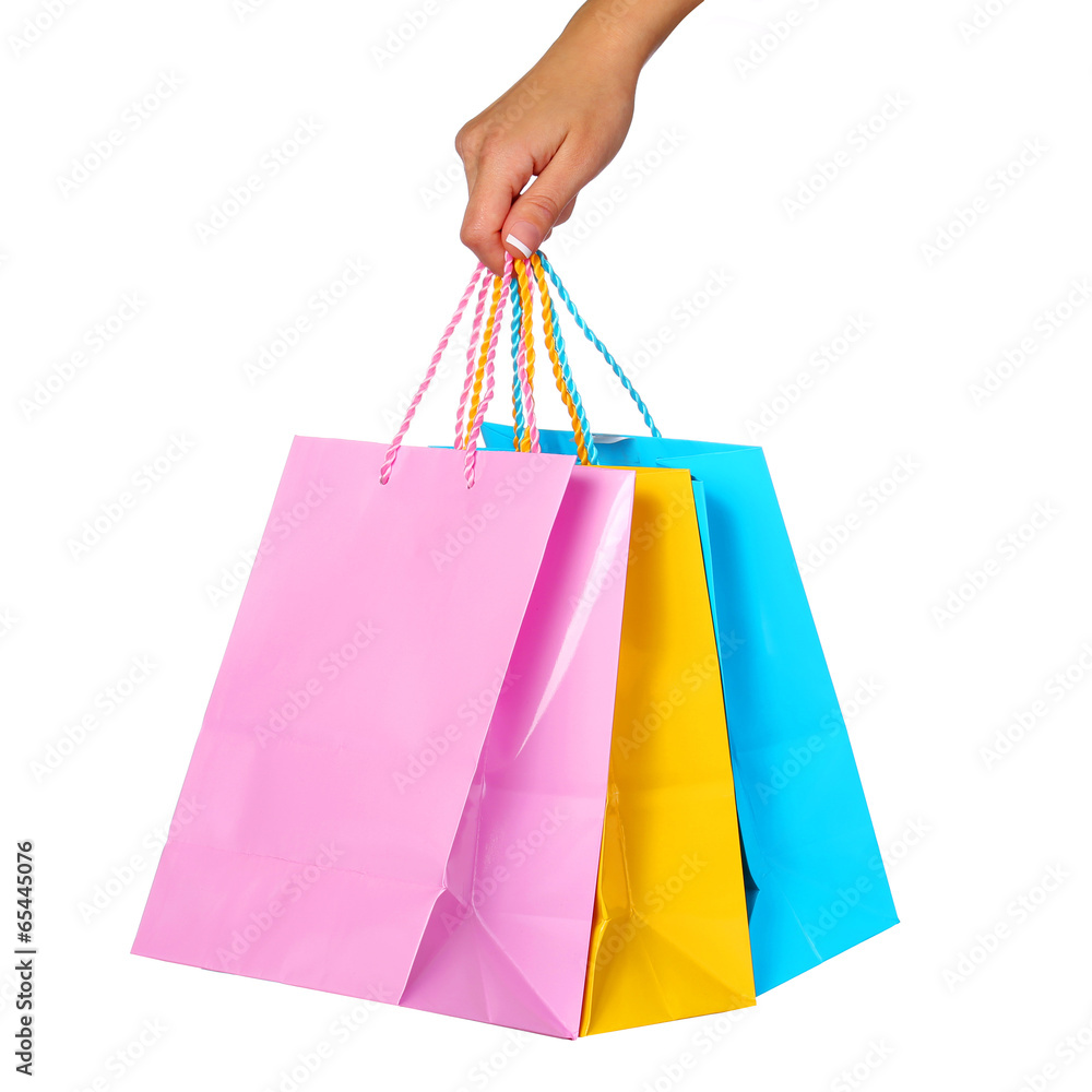 Female Hand Holding Colorful Shopping Bags isolated