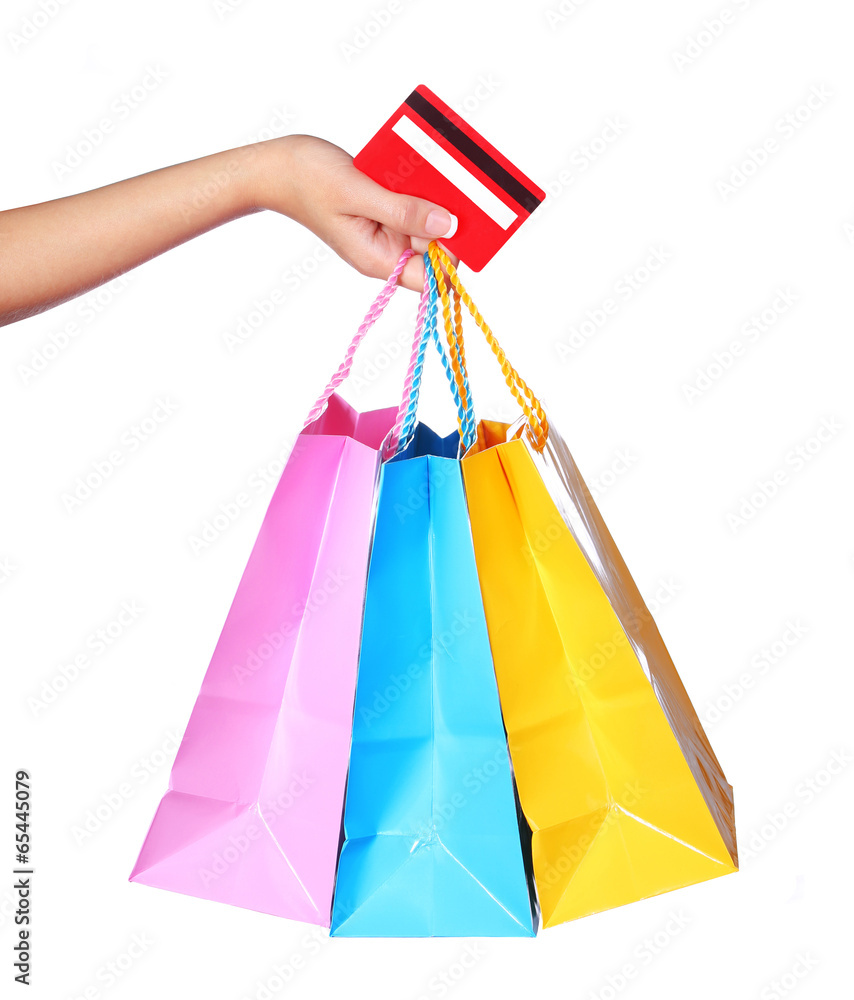 Female Hand Holding Colorful Shopping Bags and Credit Card