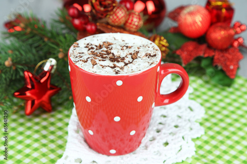 Hot chocolate with cream in color mug,