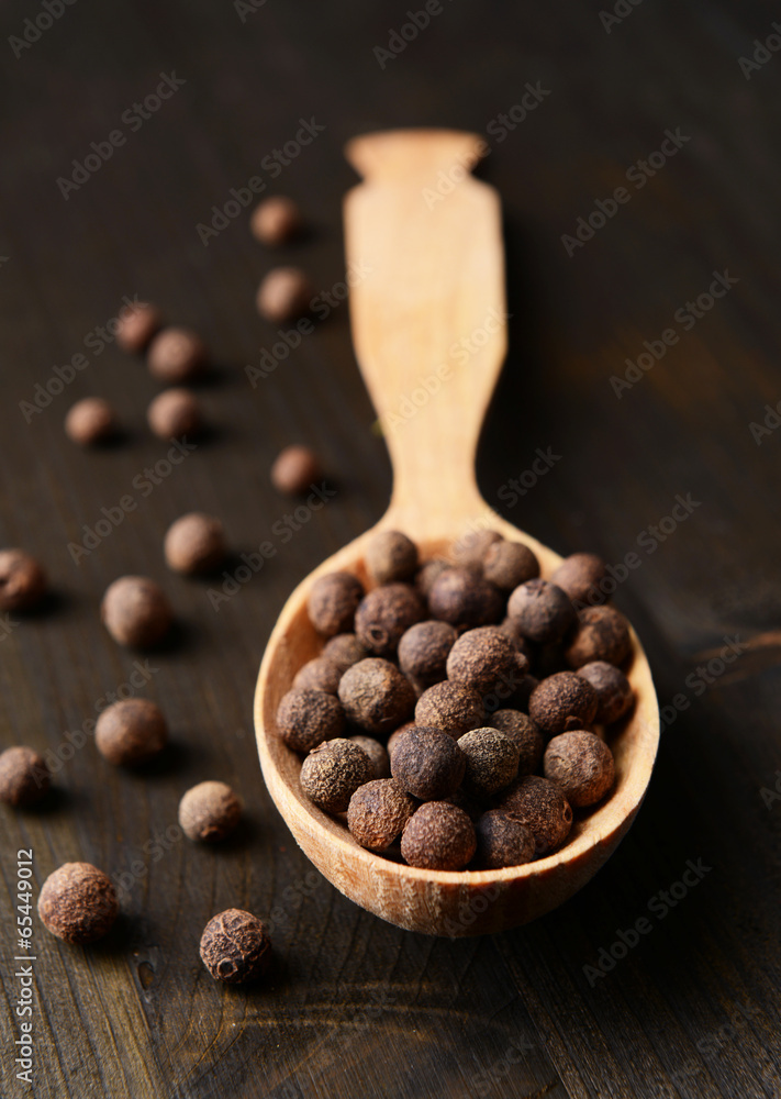 Spice pepper in spoon on wooden background Spice pepper in spoon on wooden background