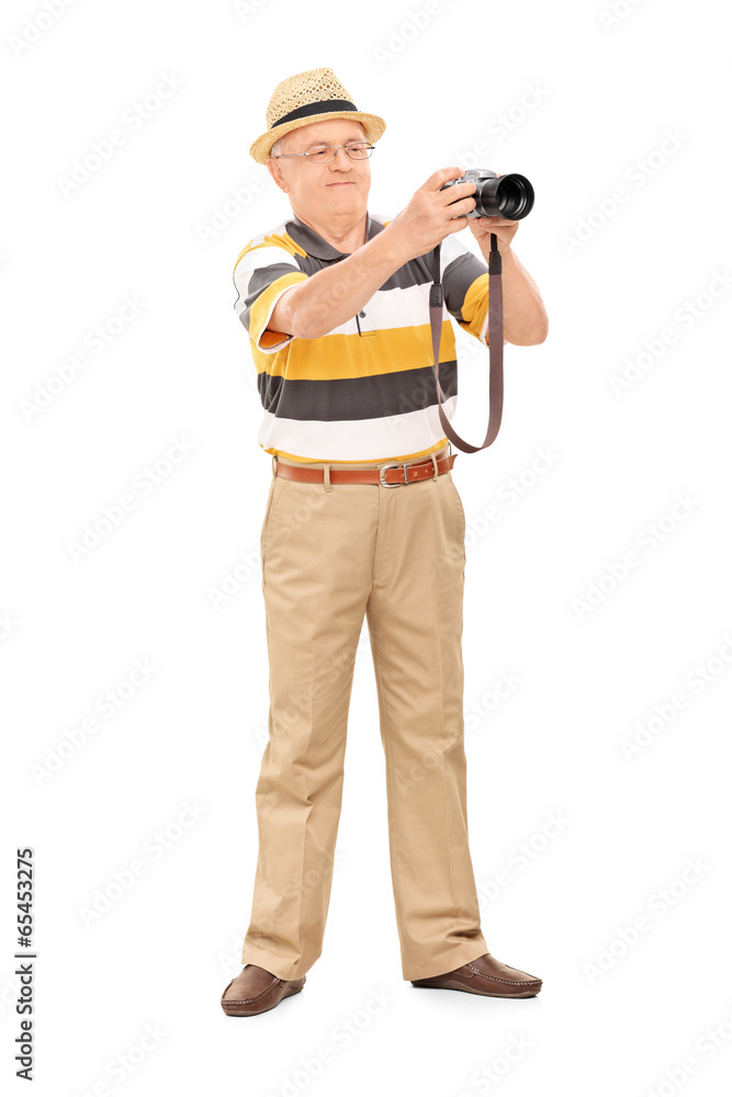 Mature man taking a picture with camera Mature man taking a picture with camera