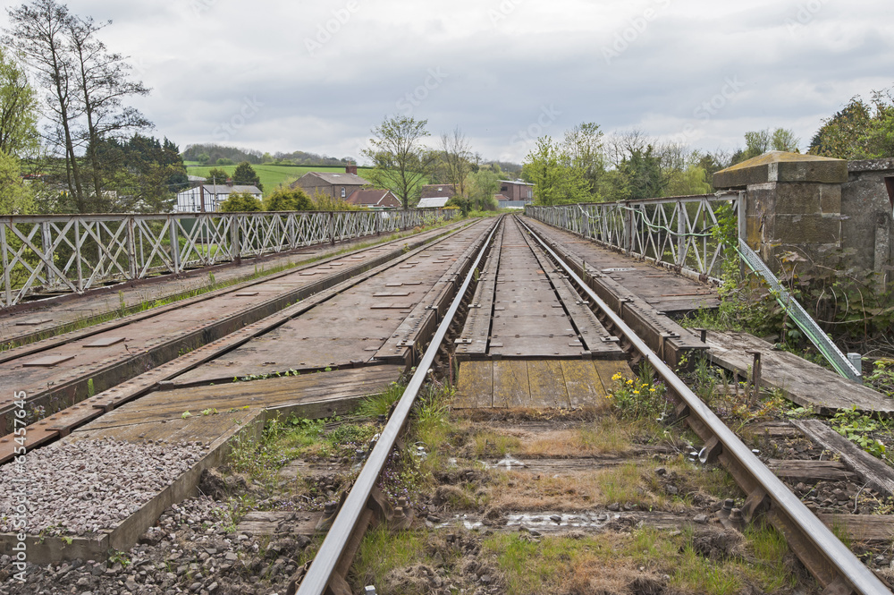 View down railway track in english countryside