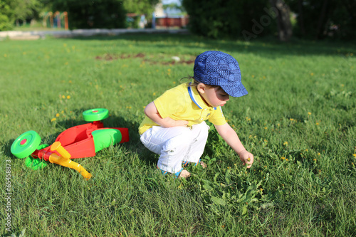 baby age of 20 months walking in summer