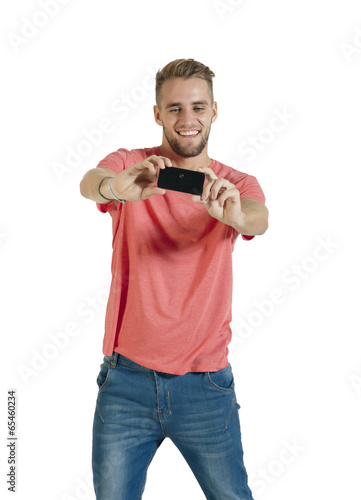 Young handsome guy taking selfie with mobile phone camera
