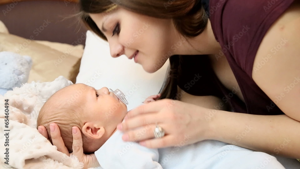 Mother kissing her newborn baby.FULL HD Mother kissing her newborn baby.FULL HD
