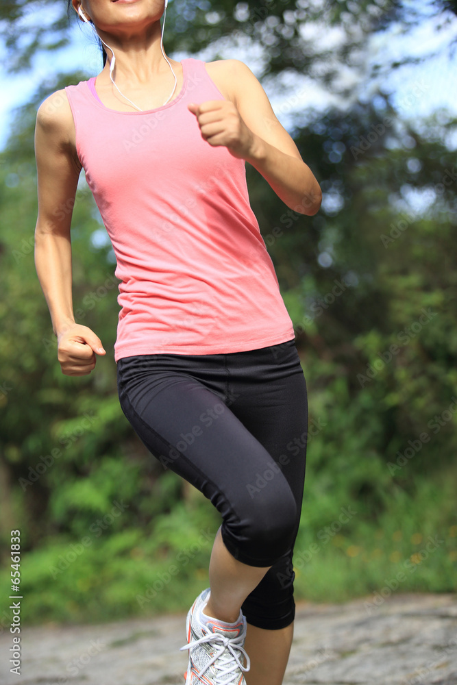 woman runner athlete running on forest trail woman runner athlete running on forest trail
