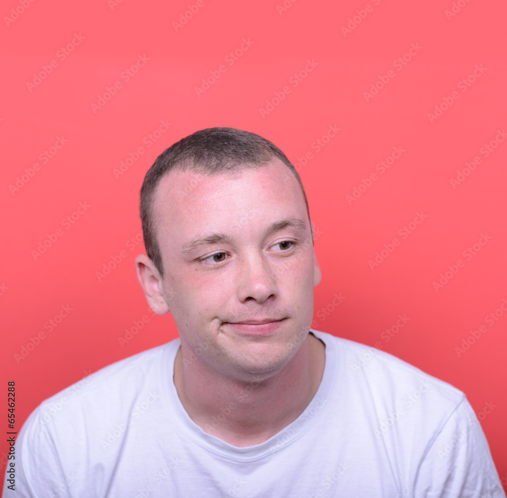 Fototapeta premium Portrait of desperate man against red background