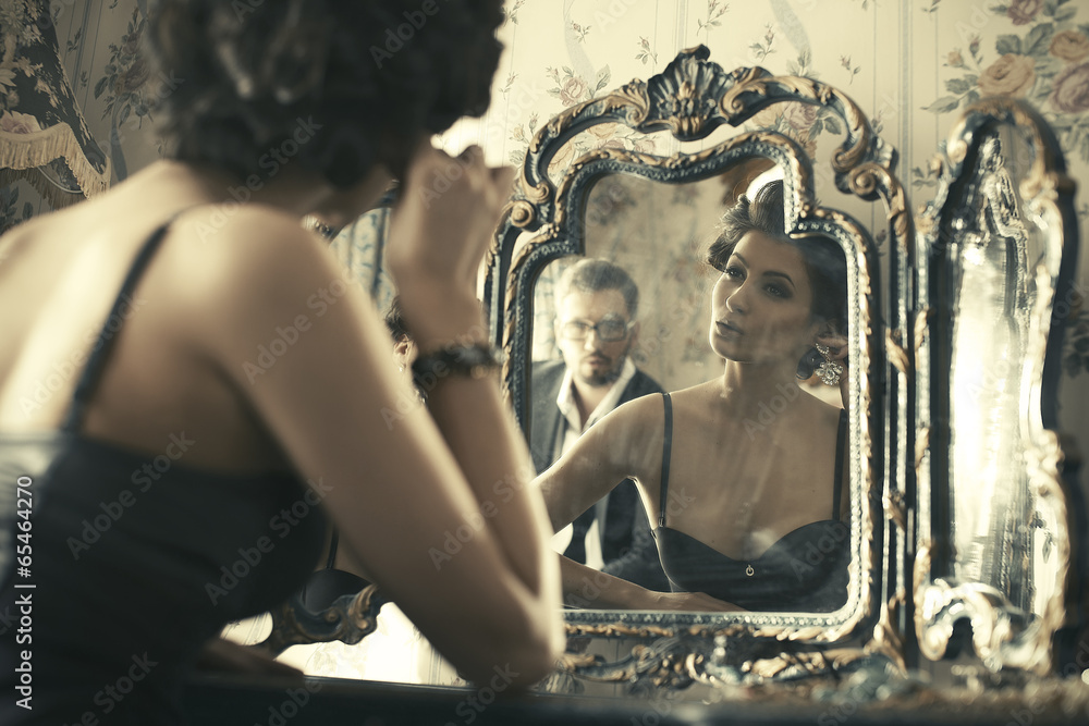 Lovely woman looking at mirror reflection. Lovely woman looking at mirror reflection.