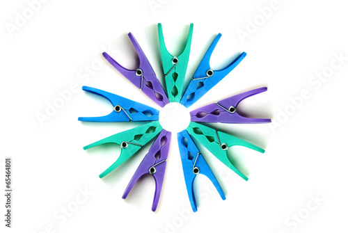 Plastic clothes pegs on a white background