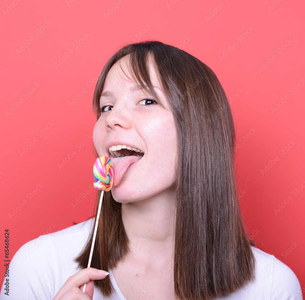 Portrait of woman licking lollipop Portrait of woman licking lollipop
