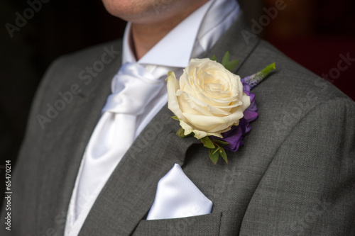 man wearing a rose buttonhole