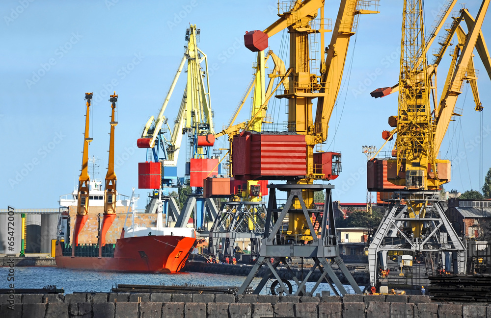 Bulk cargo ship under port crane bridge, Odessa, Ukraine