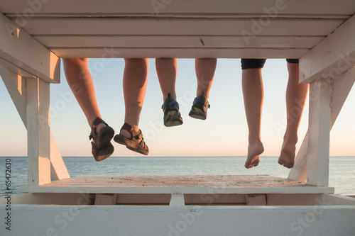 Family hanging together at sunset