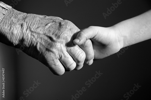 hand of grandmother and grandchild photo