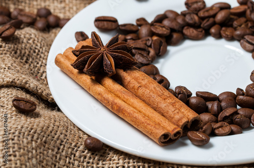 Aniseed, coffee beans and cinnamon on the plate