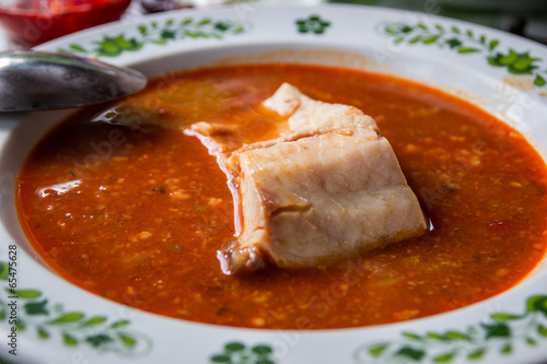 Hungarian fish soup with paprika from catfish photo