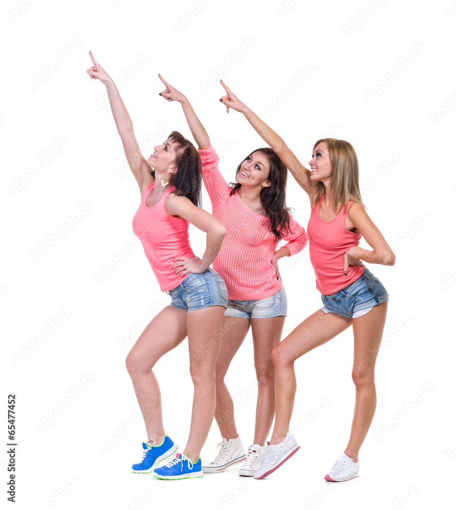 Pretty women posing in sexy jeans shorts. Isolated on white Pretty women posing in sexy jeans shorts. Isolated on white