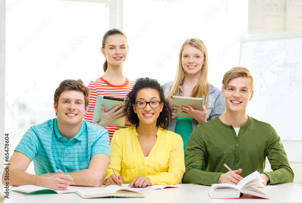 Fototapeta premium students with textbooks and books at school