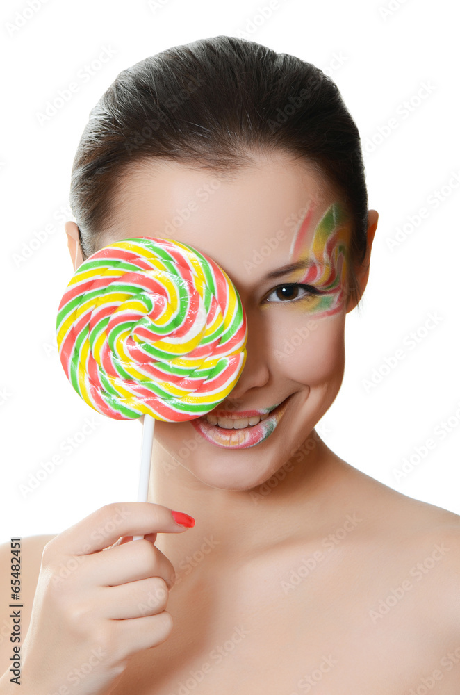 The girl with a sugar candy isolated on white