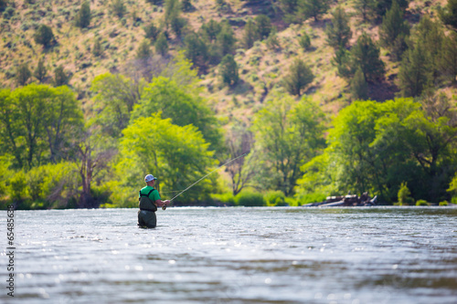 Fly Fisherman Casting on the Deschutes River