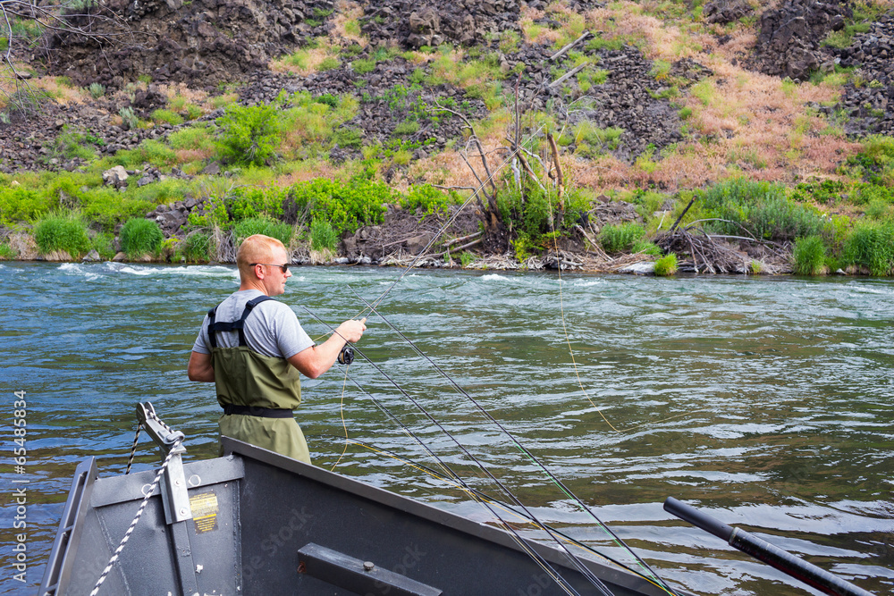 Fly Fisherman Casting on the Deschutes River Fly Fisherman Casting on the Deschutes River