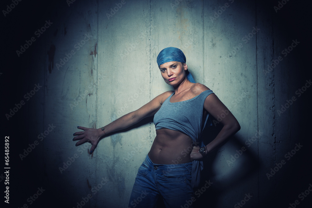Woman on concrete Wall Background.