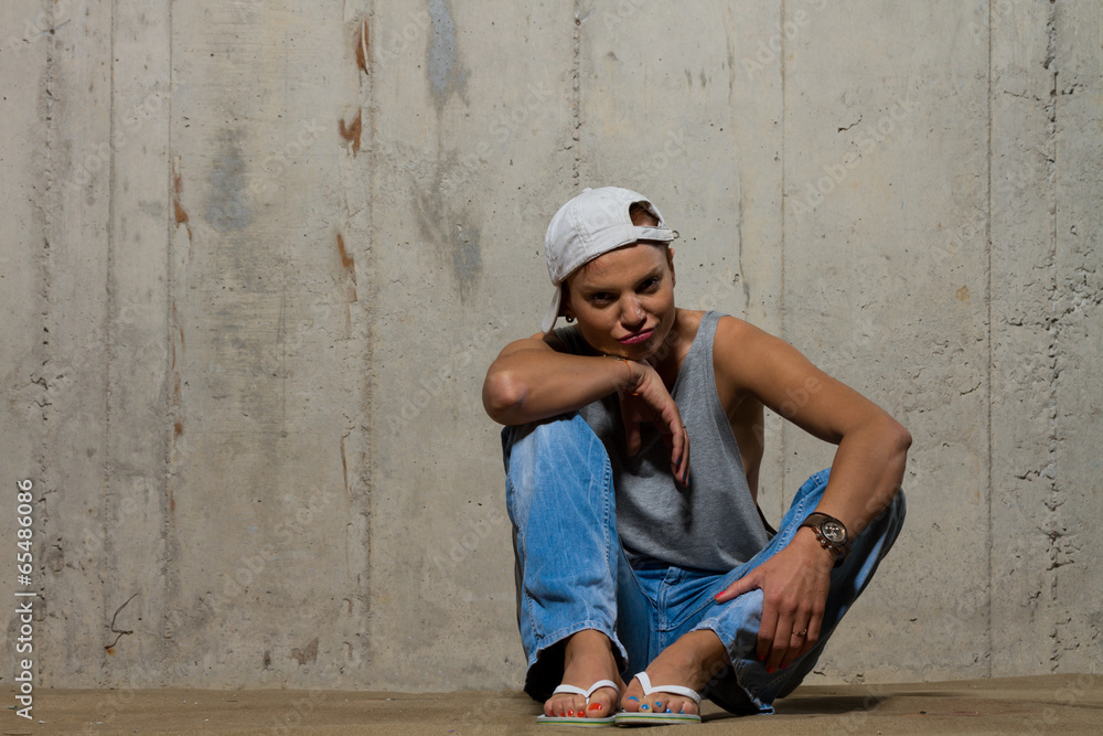Woman on concrete Wall Background. Woman on concrete Wall Background.