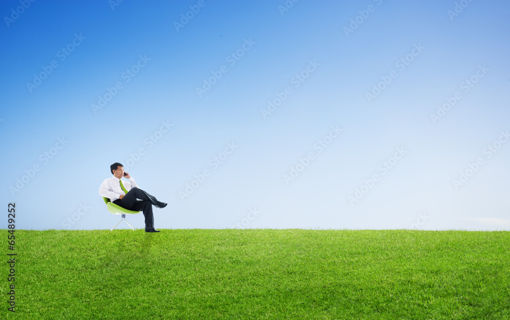 Business Man Sitting And Talking On The Phone Outdoors Business Man Sitting And Talking On The Phone Outdoors