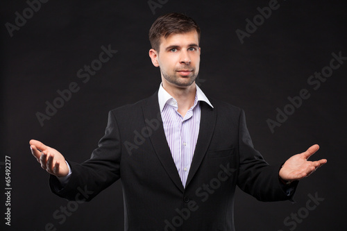 Young businessman in a black suit