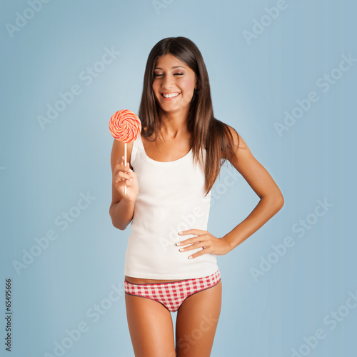 Photography Happy woman portrait with lollipop against colorful blue backgro