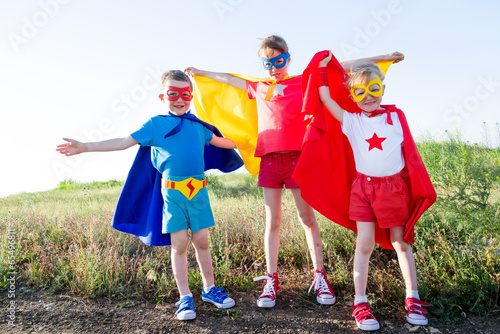 children  acting like a super hero photo