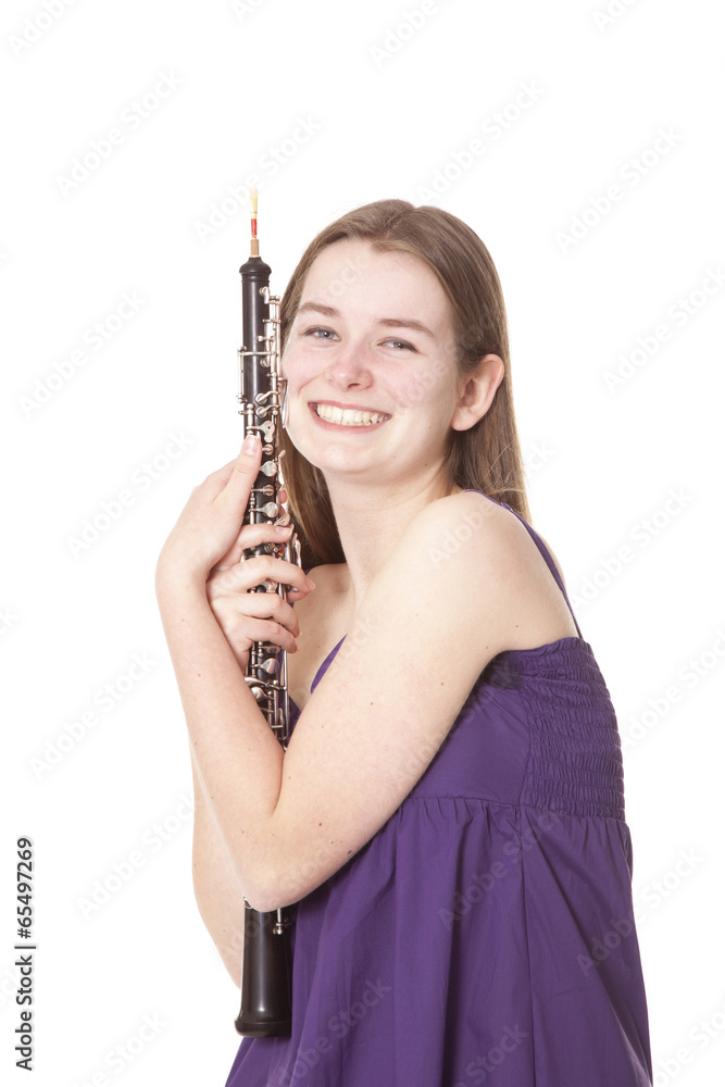 smiling girl in purple dress with oboe smiling girl in purple dress with oboe
