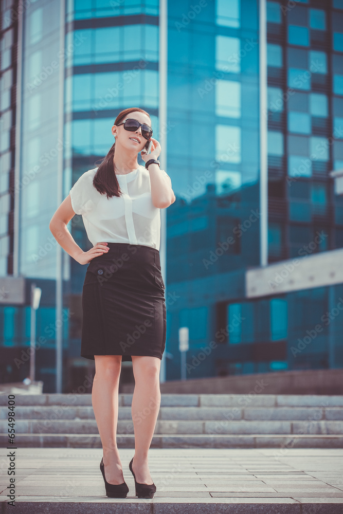 Fototapeta premium Successful businessman talking on cellphone.