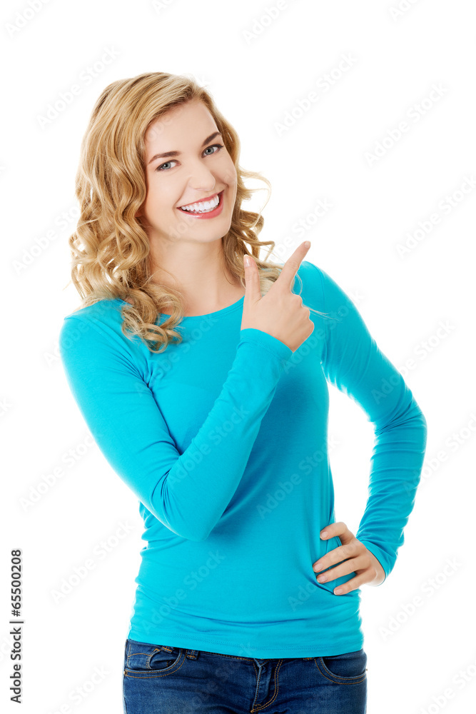 Woman pointing on copy space. Woman pointing on copy space.
